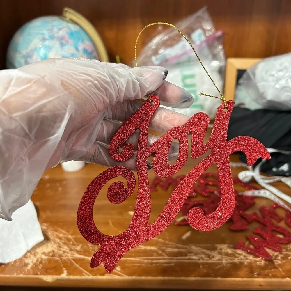 Red Glittery Cursive “Joy” Christmas Ornament - “Dressing”